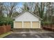 Detached three-car garage with ample parking space, set within a fenced yard at 3074 Cascade Sw Rd, Atlanta, GA 30311