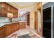 Traditional kitchen with oak cabinets and a view into the dining area at 3074 Cascade Sw Rd, Atlanta, GA 30311
