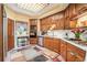 Bright kitchen with oak cabinets, stainless steel appliances, and recessed lighting at 3074 Cascade Sw Rd, Atlanta, GA 30311