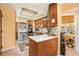 Well-lit kitchen featuring wooden cabinets, modern appliances, and a breakfast bar area at 3074 Cascade Sw Rd, Atlanta, GA 30311