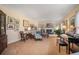 Cozy living room featuring a piano, fireplace, and an array of framed artwork at 3074 Cascade Sw Rd, Atlanta, GA 30311