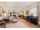 Bright and airy living room with a fireplace, piano, and comfortable seating at 3074 Cascade Sw Rd, Atlanta, GA 30311