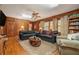 Inviting living room with wood paneling, hardwood floors, and comfortable seating at 3074 Cascade Sw Rd, Atlanta, GA 30311