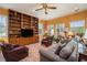 Living room with a wall of windows, built-in bookcases, and comfortable seating at 3074 Cascade Sw Rd, Atlanta, GA 30311
