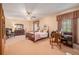 Spacious bedroom with a ceiling fan, dresser, and a large window with curtains at 3074 Cascade Sw Rd, Atlanta, GA 30311