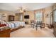 Spacious main bedroom showcasing neutral walls, comfortable seating area, and large window at 3074 Cascade Sw Rd, Atlanta, GA 30311