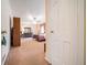 Spacious main bedroom with neutral carpet, ceiling fan, and walk-in closet at 3074 Cascade Sw Rd, Atlanta, GA 30311