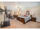 Spacious main bedroom showcasing carpet floors, a comfortable king bed and an en suite bathroom at 3074 Cascade Sw Rd, Atlanta, GA 30311