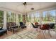 Enclosed sunroom provides a relaxing seating area and lots of light at 3074 Cascade Sw Rd, Atlanta, GA 30311