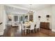 Open-concept dining and living room features dark wood floors and ample natural light at 55 Church St, Alpharetta, GA 30009