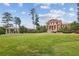 Beautiful Georgian-style building on a manicured lawn, perfect for community events and outdoor gatherings at 55 Church St, Alpharetta, GA 30009