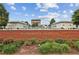 The entrance to Alpharetta, GA, brick wall with fountains, and lush landscaping at 55 Church St, Alpharetta, GA 30009