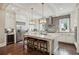 Bright kitchen with a large center island, stainless steel appliances and modern lighting at 55 Church St, Alpharetta, GA 30009