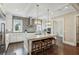 Bright kitchen with a large center island, stainless steel appliances and modern lighting at 55 Church St, Alpharetta, GA 30009