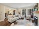 Comfortable living room with hardwood floors, natural light, a fireplace, and stylish decor at 55 Church St, Alpharetta, GA 30009
