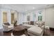 Comfortable living room with hardwood floors, a seating area, and access to other areas at 55 Church St, Alpharetta, GA 30009