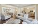 Spacious living room featuring hardwood floors, neutral tones, open to dining and kitchen areas at 55 Church St, Alpharetta, GA 30009