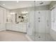 Modern shower with glass surround, dual shower heads, and a built-in bench in the en suite bathroom at 55 Church St, Alpharetta, GA 30009