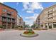 Charming streetscape view with brick sidewalks, street lamps, boutique shops and upscale condos at 55 Church St, Alpharetta, GA 30009