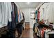 Functional walk-in closet with clothing racks and shelving, leading to the laundry room at 55 Church St, Alpharetta, GA 30009