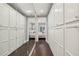 Long walk-in closet with mirrored doors on cabinets leading to the bedroom, offering ample storage at 55 Church St, Alpharetta, GA 30009