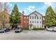 Exterior view of a multi-story condo building with brick and siding at 5641 Roswell Rd # 307, Sandy Springs, GA 30342