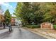 Brighton Court condominium entrance sign with brick building in background at 5641 Roswell Rd # 307, Sandy Springs, GA 30342