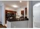 Modern kitchen with stainless steel appliances, granite countertops, and a breakfast bar at 5641 Roswell Rd # 307, Sandy Springs, GA 30342