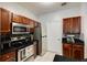Updated kitchen with stainless steel appliances, dark cabinetry and a tile backsplash at 5641 Roswell Rd # 307, Sandy Springs, GA 30342