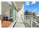 Condo balcony with glass railings providing panoramic views of the city at 1100 Howell Mill Nw Rd # 613, Atlanta, GA 30318