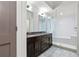 Modern bathroom featuring double vanity, sleek fixtures, and luxurious glass-enclosed shower with white subway tile at 1100 Howell Mill Nw Rd # 613, Atlanta, GA 30318