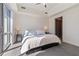 Sunlit bedroom featuring a large window, neutral tones, and plush bedding at 1100 Howell Mill Nw Rd # 613, Atlanta, GA 30318