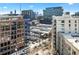 Stunning city view of the condo building offering modern architecture, lush greenery, and urban convenience at 1100 Howell Mill Nw Rd # 613, Atlanta, GA 30318