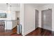 Entryway with hardwood floors leading to an open kitchen area at 1100 Howell Mill Nw Rd # 613, Atlanta, GA 30318