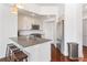 Kitchen featuring a counter with stools and stainless steel appliances at 1100 Howell Mill Nw Rd # 613, Atlanta, GA 30318