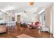 Large living room with hardwood floors, contemporary furnishings, and an open layout to the kitchen at 1100 Howell Mill Nw Rd # 613, Atlanta, GA 30318