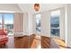 Bright living room corner with large windows offering skyline views and hardwood floors at 1100 Howell Mill Nw Rd # 613, Atlanta, GA 30318
