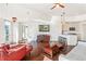 Open-concept living room with hardwood floors, modern lighting, and views of the kitchen at 1100 Howell Mill Nw Rd # 613, Atlanta, GA 30318