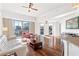 Spacious living room boasting hardwood floors, high ceilings, and city views from large sliding glass doors at 1100 Howell Mill Nw Rd # 613, Atlanta, GA 30318
