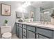 Updated bathroom with glass shower, modern vanity, stylish decor, and neutral color palette at 214 Ridley Howard Ct, Decatur, GA 30030