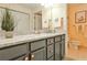 Bathroom featuring a marble countertop, gray cabinetry, and decorative fixtures at 214 Ridley Howard Ct, Decatur, GA 30030