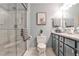 Updated bathroom with glass shower, modern vanity, stylish decor, and neutral color palette at 214 Ridley Howard Ct, Decatur, GA 30030