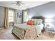 Comfortable bedroom with natural light and colorful quilt at 214 Ridley Howard Ct, Decatur, GA 30030