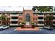 Charming brick apartment building with large arched window and well-maintained landscaping at 214 Ridley Howard Ct, Decatur, GA 30030