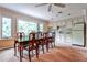 Bright dining area with natural light, a spacious table, and adjacent kitchen at 214 Ridley Howard Ct, Decatur, GA 30030