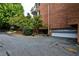 Building with attached covered garage and well-maintained landscaping at 214 Ridley Howard Ct, Decatur, GA 30030