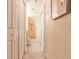 Hallway with multiple storage closets, open door to bathroom at 214 Ridley Howard Ct, Decatur, GA 30030