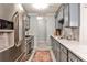 Well-appointed kitchen featuring stainless steel appliances, stone countertops, and tile backsplash at 214 Ridley Howard Ct, Decatur, GA 30030