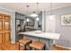Stylish kitchen features stainless steel appliances, an island with bar seating, and lovely cabinetry at 214 Ridley Howard Ct, Decatur, GA 30030