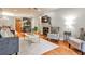 Inviting living room featuring a fireplace, stylish furniture, and seamless flow to the kitchen at 214 Ridley Howard Ct, Decatur, GA 30030